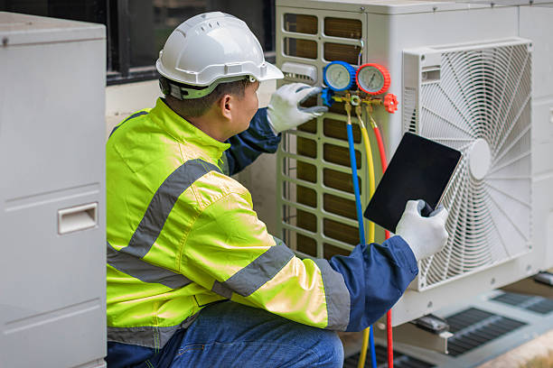Professional Heat Pump Repair technician working in Satsuma, AL